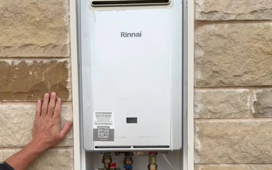 Tankless water heater with service valves